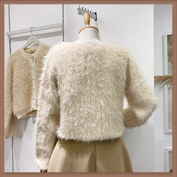 Cremefarbene Strickjacke mit Pelz